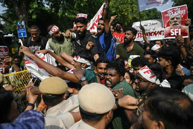 Student activists shout slogans during a protest demanding the resignation of the nation's Chief Election Commissioner Gyanesh Kumar over alleged voter roll irregularities linked to the "special intensive revision" (SIR), in New Delhi on October 14, 2026. (Photo by Arun SANKAR / AFP)