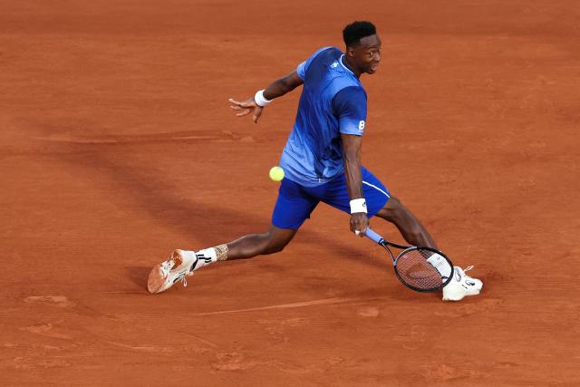 (FILES) France's Gael Monfils plays a backhand return to France's Hugo Gaston during their men's singles match on day 2 of the French Open tennis tournament on Court Philippe-Chatrier at the Roland-Garros Complex in Paris on May 25, 2026. Monfils has officially “retired” from the professional tour as of October 5, the International Tennis Integrity Agency (ITIA) confirmed to AFP on October 14, 2026. (Photo by ALAIN JOCARD / AFP)
