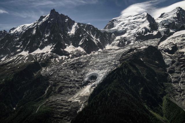 (FILES) This photograph shows a view of a hole on the Bossons glacier in the Mont-Blanc massif of the Alps in the Chamonix valley, central-eastern France on June 17, 2026. Mont Blanc, the highest peak in Western Europe in the Alps, was measured in September 2026 at 4,807.47 meters—1.88 meters higher than the previous measurement reported in 2023—French surveyors announced on October 14, 2026. (Photo by Jeff PACHOUD / AFP)