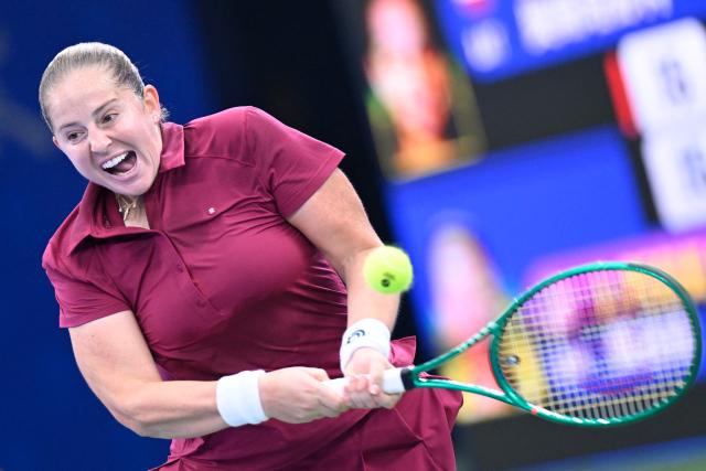 Latvia's Jelena Ostapenko hits a return to USA's Jessica Pegula during their women's singles match at the Wuhan Open tennis tournament in Wuhan, China's Hubei province on October 14, 2026. (Photo by WANG Zhao / AFP)