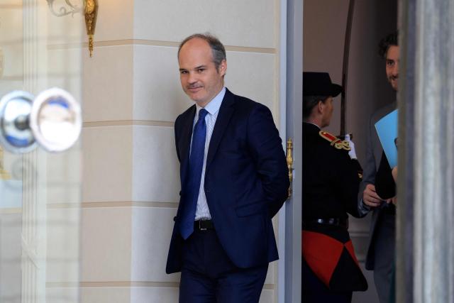 French presidency's international communication advisor Jonas Bayard leaves the presidential Elysee Palace following the weekly Cabinet meeting in Paris on October 14, 2026. (Photo by Ludovic MARIN / AFP)