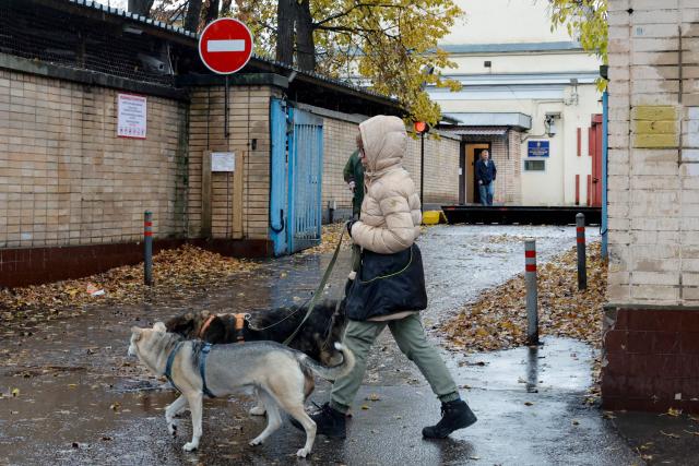 A woman walks dogs past Moscow's high-security Lefortovo prison, used to jail those being investigated by the FSB security services, on October 14, 2026. Tokyo said on October 14, 2026 it had urged Moscow to ensure "fair and impartial treatment" of a Japanese journalist who was arrested by Russia on suspicion of espionage. Moscow accused the man -- Yuki Imai, a reporter with the Hokkaido Shimbun newspaper -- of working for Japanese intelligence to collect information about Russia's defensive capabilities on the Far East island of Sakhalin. (Photo by TATYANA MAKEYEVA / AFP)