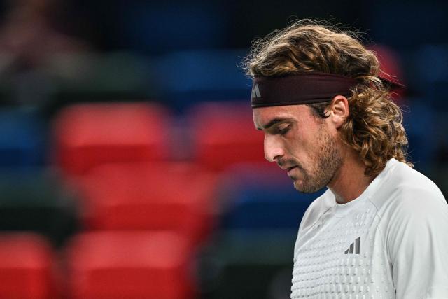 Greece's Stefanos Tsitsipas reacts after a point against Russia's Daniil Medvedev during their men's singles match at the Shanghai Masters tennis tournament in Shanghai on October 14, 2026. (Photo by Hector RETAMAL / AFP)