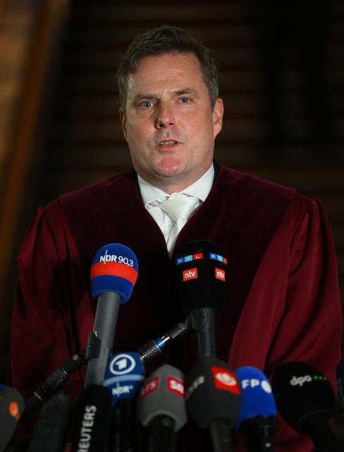 Senior public prosecutor Stefan Schmidt talks to journalists after the first day of the trial against defendant Ukrainian national Sergiy Kuznietsov, accused of leading a team of Ukrainians that blew up the gas pipelines in 2022 in Hamburg, northern Germany on October 14, 2026. According to the indictment filed by the Federal Public Prosecutors Office, Sergiy Kuznietsov (also Serhii Kuznietsov), who was arrested in 2025 while on vacation in Italy, is alleged to have planned the act together with other members of the Ukrainian military. In addition, the defendant is said to have led the team that blew up the natural gas pipelines under the Baltic Sea at the end of September 2022. The pipelines were used to transport Russian natural gas to Germany. According to the indictment, the attack was carried out on behalf of Ukrainian state authorities; the background was the Russian war of aggression against Ukraine, which began in early 2022. The Ukrainian government denies any official involvement. (Photo by Gregor Fischer / AFP)