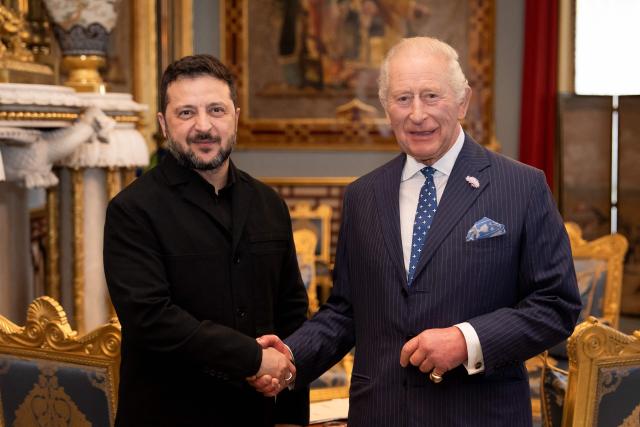 Britain's King Charles III greets President of Ukraine Volodymyr Zelensky during an audience at Buckingham Palace in central London on October 14, 2026. (Photo by Aaron Chown / POOL / AFP)