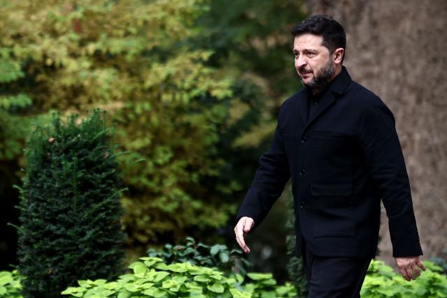 Ukraine's President Volodymyr Zelensky arrives to meet with Britain's Prime Minister Andy Burnham at 10 Downing Street, in central London, on October 14, 2026. (Photo by Henry Nicholls / POOL / AFP)