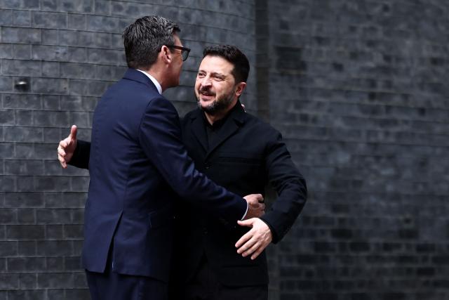 Britain's Prime Minister Andy Burnham (L) greets Ukraine's President Volodymyr Zelensky on the steps of 10 Downing Street, in central London, on October 14, 2026, ahead of their meeting. (Photo by Henry Nicholls / POOL / AFP)