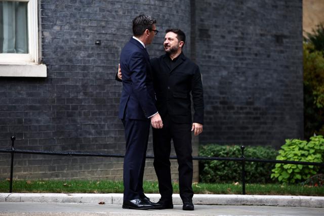 Britain's Prime Minister Andy Burnham (L) greets Ukraine's President Volodymyr Zelensky on the steps of 10 Downing Street, in central London, on October 14, 2026, ahead of their meeting. (Photo by Henry Nicholls / POOL / AFP)