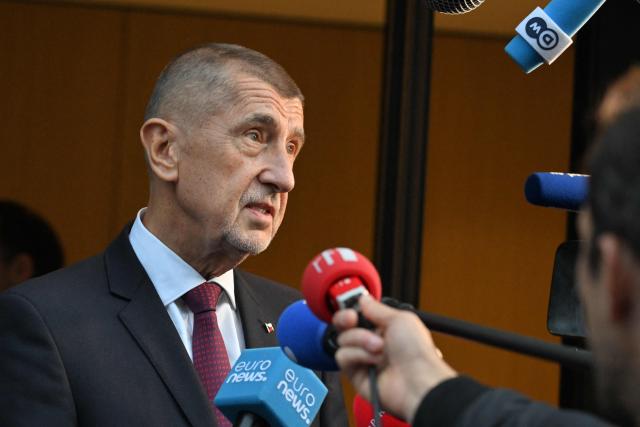 Czech Prime Minister Andrej Babis answers journalists' questions as he arrives to attend a meeting of Patriots parliamentary group on the eve of an EU Summit in Brussels on October 14, 2026. (Photo by Nicolas TUCAT / AFP)