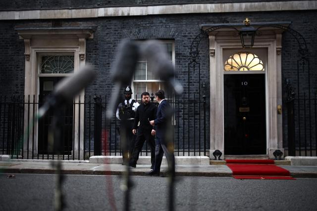 Britain's Prime Minister Andy Burnham sees off Ukraine's President Volodymyr Zelensky outside 10 Downing Street, in central London, on October 14, 2026, following their meeting. (Photo by Henry Nicholls / POOL / AFP)