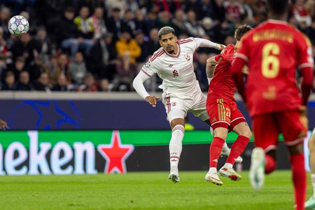 Liverpool's Uruguayan defender #33 Ronald Araujo (L) and LASK's Austrian forward #27 Christoph Lang vie for the ball during the UEFA Champions League football match between LASK and Liverpool FC in Linz, Austria on October 14, 2026. (Photo by Branislav Racko / AFP)