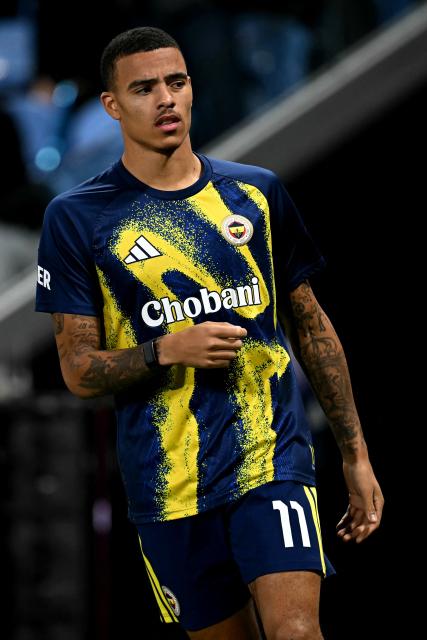 Fenerbahce's English striker #11 Mason Greenwood warms up ahead of the UEFA Champions League, league phase football match between Aston Villa and Fenerbahce at Villa Park in Birmingham, central England on October 14, 2026. (Photo by Paul ELLIS / AFP)