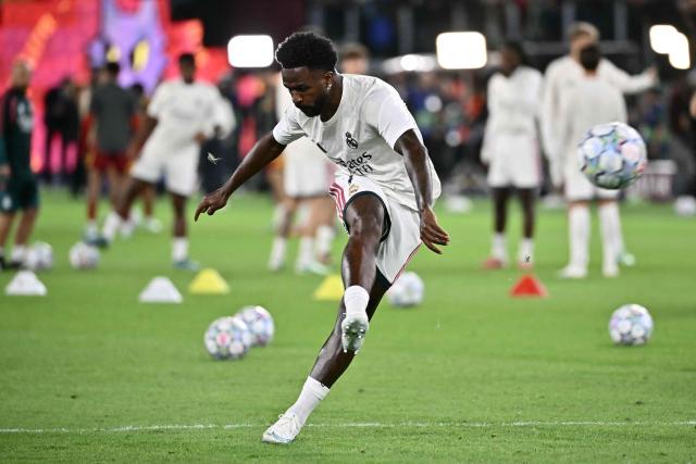 Real Madrid's Brazilian forward #07 Vinicius Junior warms up before the UEFA Champions League - 1st round day 2 football match between AS Roma and Real Madrid at the Olympic Stadium in Rome on October 14, 2026. (Photo by Filippo MONTEFORTE / AFP)