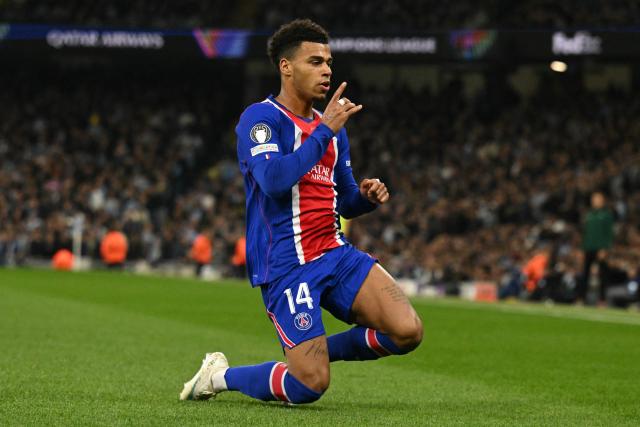 Paris Saint-Germain's French midfielder #14 Desire Doue celebrates scoring the opening goal during the UEFA Champions League, league phase football match between Manchester City and Paris Saint Germain at the Etihad Stadium in Manchester, north west England, on October 14, 2026. (Photo by Oli SCARFF / AFP)