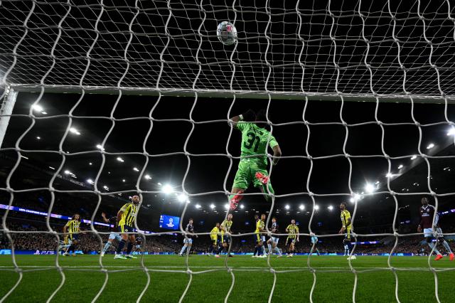 Fenerbahce's Brazilian goalkeeper #31 Ederson makes a save during the UEFA Champions League, league phase football match between Aston Villa and Fenerbahce at Villa Park in Birmingham, central England on October 14, 2026. (Photo by Paul ELLIS / AFP)