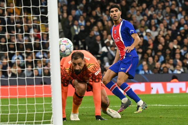 Paris Saint-Germain's Moroccan defender #02 Achraf Hakimi watches as his attempt hits the post during the UEFA Champions League, league phase football match between Manchester City and Paris Saint Germain at the Etihad Stadium in Manchester, north west England, on October 14, 2026. (Photo by Oli SCARFF / AFP)