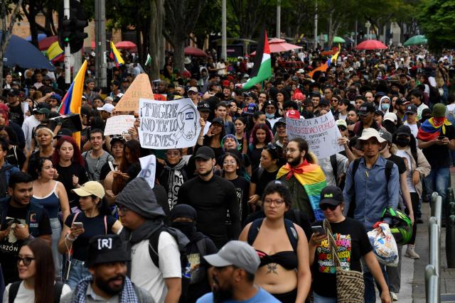 Demonstrators take part in a protest against the government of Colombian President Abelardo de la Espriella in Medellin, Colombia, on October 14, 2026, during a nationwide day of demonstrations called by labor unions, teachers' organizations, student groups and opposition sectors. (Photo by Jaime SALDARRIAGA / AFP)