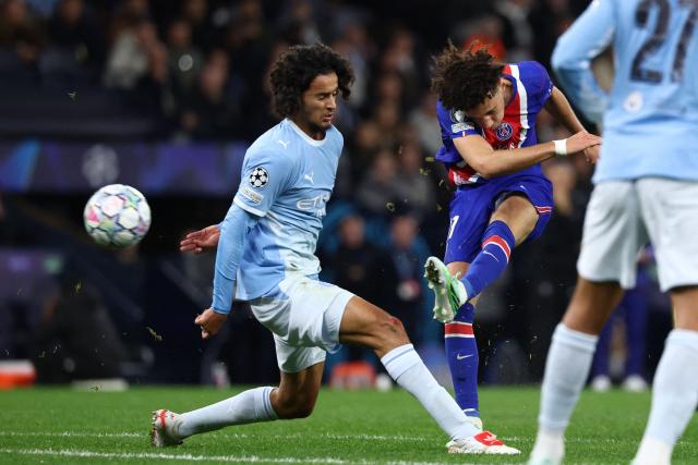 Paris Saint-Germain's French midfielder #11 Maghnes Akliouche shoots to score their fourth goal during the UEFA Champions League, league phase football match between Manchester City and Paris Saint Germain at the Etihad Stadium in Manchester, north west England, on October 14, 2026. (Photo by FRANCK FIFE / AFP)