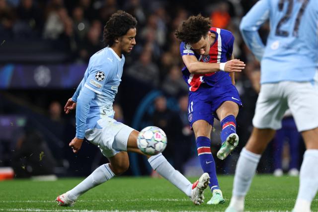 Paris Saint-Germain's French midfielder #11 Maghnes Akliouche shoots to score their fourth goal during the UEFA Champions League, league phase football match between Manchester City and Paris Saint Germain at the Etihad Stadium in Manchester, north west England, on October 14, 2026. (Photo by FRANCK FIFE / AFP)