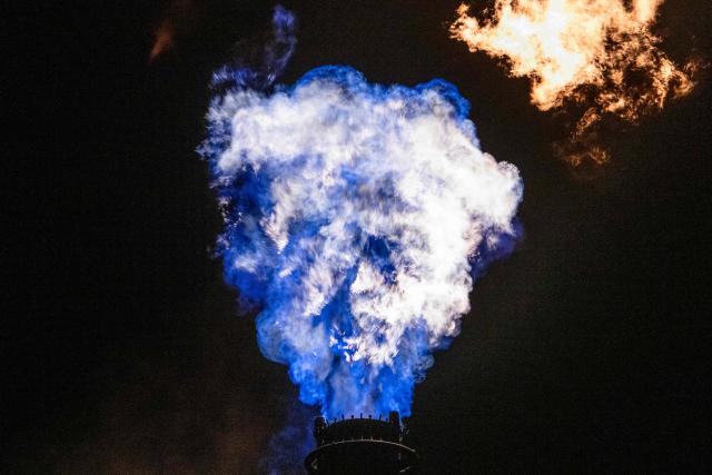 A flare stack burns off byproduct gasses at the Toa oil refinery in Kawasaki on October 14, 2026. (Photo by Andrew Caballero-Reynolds / AFP)