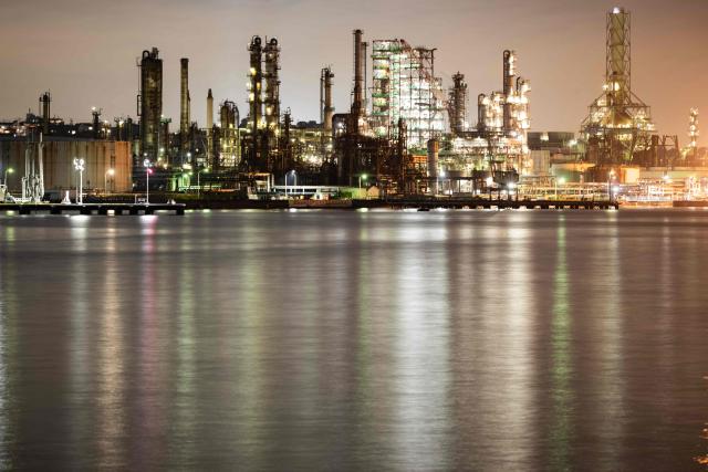 Lights illuminate the Eneos Corporation Negishi oil refinery in Yokohama on October 14, 2026. (Photo by Andrew Caballero-Reynolds / AFP)