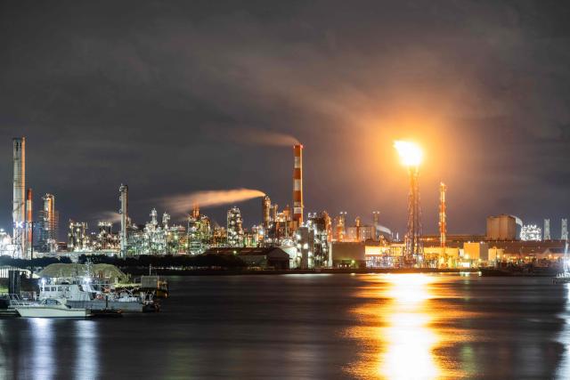 A flare stack burns off byproduct gasses at the Toa oil refinery in Kawasaki on October 14, 2026. (Photo by Andrew Caballero-Reynolds / AFP)