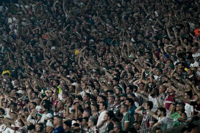 Fluminense's fans cheer their team ahead of the Copa Libertadores semifinal first leg football match between Brazil's Fluminense and Palmeiras at the Maracana stadium in Rio de Janeiro, Brazil, on October 14, 2026. (Photo by Pablo PORCIUNCULA / AFP)