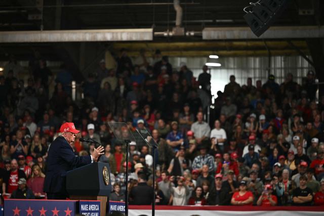 US President Donald Trump speaks during a campaign rally at the Majestic Valley Arena in Kalispell, Montana on October 14, 2026. President Trump is campaigning for US Congressional candidate Aaron Flint. (Photo by Kent NISHIMURA / AFP)