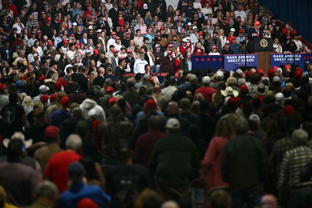 Supporters listen to US President Donald Trump speak during a campaign rally at the Majestic Valley Arena in Kalispell, Montana on October 14, 2026. President Trump is campaigning for US Congressional candidate Aaron Flint. (Photo by Kent NISHIMURA / AFP)