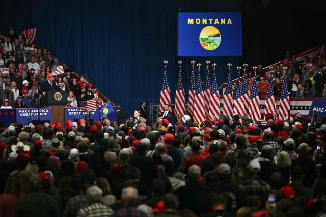 Supporters listen to US President Donald Trump speak during a campaign rally at the Majestic Valley Arena in Kalispell, Montana on October 14, 2026. President Trump is campaigning for US Congressional candidate Aaron Flint. (Photo by Kent NISHIMURA / AFP)
