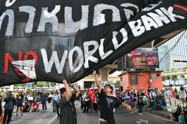 EDITORS NOTE: Graphic content / Demonstrators take part in a protest against the International Monetary Fund (IMF) and World Bank Group in Bangkok on October 15, 2026, as the IMF Annual Meetings take place in the Thai capital. (Photo by ANTHONY WALLACE / AFP)