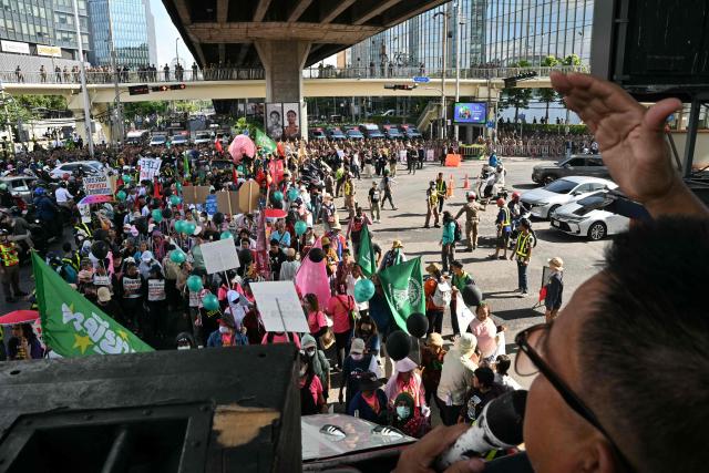 Demonstrators take part in a protest against the International Monetary Fund (IMF) and World Bank Group in Bangkok on October 15, 2026, as the IMF Annual Meetings take place in the Thai capital. (Photo by ANTHONY WALLACE / AFP)
