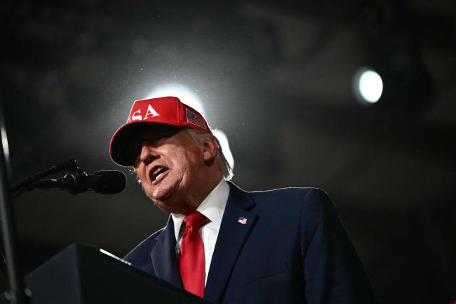 US President Donald Trump speaks during a campaign rally at the Majestic Valley Arena in Kalispell, Montana on October 14, 2026. President Trump is campaigning for US Congressional candidate Aaron Flint. (Photo by Kent NISHIMURA / AFP)