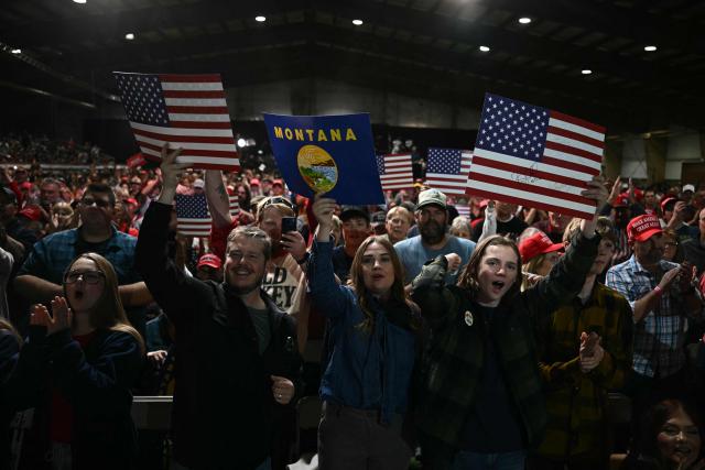 Supporters cheer US President Donald Trump as he walks off stage at a campaign rally at the Majestic Valley Arena in Kalispell, Montana on October 14, 2026. President Trump is campaigning for US Congressional candidate Aaron Flint. (Photo by Kent NISHIMURA / AFP)