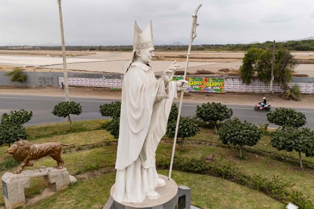 A statue of Pope Leo XIV is pictured in Chiclayo, Lambayeque department, northern Peru, on October 12, 2026. In northern Peru, the self-anointed "city of Pope Leo XIV" is feverishly preparing for a visit by its former bishop, despite the pontiff's lung cancer diagnosis raising doubts over his travel plans. (Photo by Ernesto BENAVIDES / AFP)