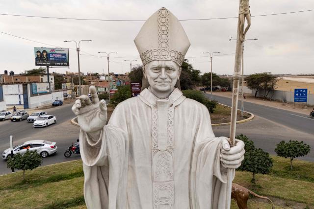 A statue of Pope Leo XIV is pictured in Chiclayo, Lambayeque department, northern Peru, on October 12, 2026. In northern Peru, the self-anointed "city of Pope Leo XIV" is feverishly preparing for a visit by its former bishop, despite the pontiff's lung cancer diagnosis raising doubts over his travel plans. (Photo by Ernesto BENAVIDES / AFP)
