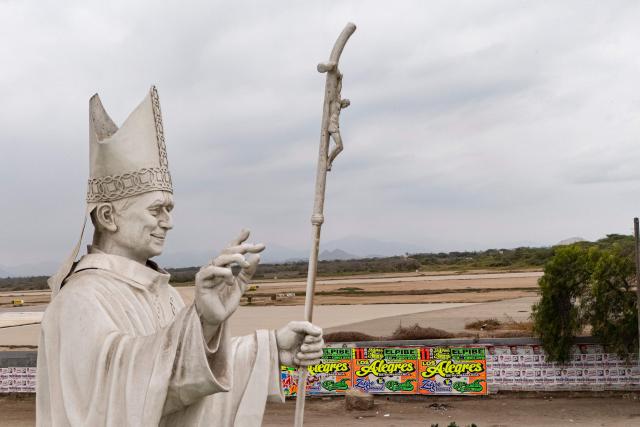 A statue of Pope Leo XIV is pictured in Chiclayo, Lambayeque department, northern Peru, on October 12, 2026. In northern Peru, the self-anointed "city of Pope Leo XIV" is feverishly preparing for a visit by its former bishop, despite the pontiff's lung cancer diagnosis raising doubts over his travel plans. (Photo by Ernesto BENAVIDES / AFP)