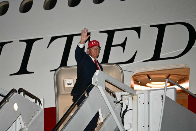 US President Donald Trump boards Air Force One at Missoula Montana Airport, in Missoula, Montana on October 14, 2026. President Trump is returning to Washington, DC after speaking at campaign rallies in Alaska, Arizona and Montana. (Photo by Kent NISHIMURA / AFP)