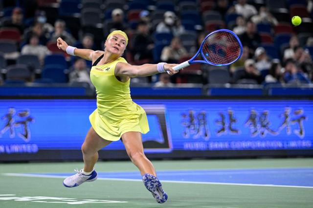 Russia's Diana Shnaider hits a return to Czech Republic's Karolina Muchova during their women's singles tennis match at the Wuhan Open tennis tournament in Wuhan, China's Hubei province on October 15, 2026. (Photo by WANG Zhao / AFP)