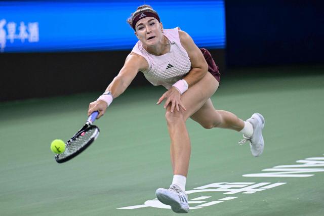 Czech Republic's Karolina Muchova hits a return to Russia's Diana Shnaider during their women's singles tennis match at the Wuhan Open tennis tournament in Wuhan, China's Hubei province on October 15, 2026. (Photo by WANG Zhao / AFP)