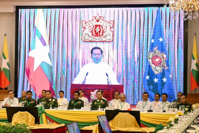 Myanmar's President Min Aung Hlaing delivers a speech via video message during a ceremony marking the 11th anniversary of the signing of the Nationwide Ceasefire Agreement (NCA) in Naypyidaw on October 15, 2026, amid the ongoing civil war that has killed an estimated 100,000 people since 2021. Myanmar marked on October 15 the 11th anniversary of the Nationwide Ceasefire Agreement (NCA), which brokered peace with some of the countrys myriad armed factions in 2015. A number of groups pulled out of the landmark deal in the wake of the 2021 military coup which unleashed a full-blown civil war. The government presents the faltering agreement as a path to new peace talks, but many of the most powerful armed factions refuse to engage. (Photo by SAI AUNG MAIN / AFP)