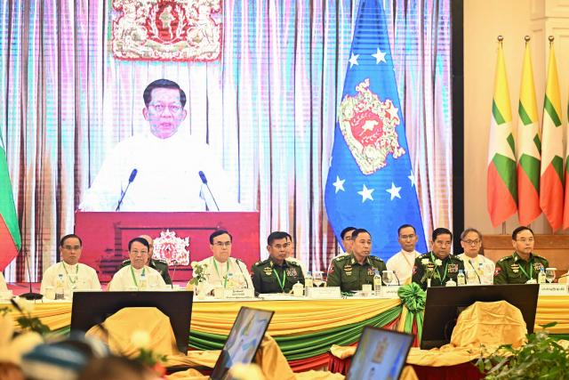 Myanmar's President Min Aung Hlaing delivers a speech via video message during a ceremony marking the 11th anniversary of the signing of the Nationwide Ceasefire Agreement (NCA) in Naypyidaw on October 15, 2026, amid the ongoing civil war that has killed an estimated 100,000 people since 2021. Myanmar marked on October 15 the 11th anniversary of the Nationwide Ceasefire Agreement (NCA), which brokered peace with some of the countrys myriad armed factions in 2015. A number of groups pulled out of the landmark deal in the wake of the 2021 military coup which unleashed a full-blown civil war. The government presents the faltering agreement as a path to new peace talks, but many of the most powerful armed factions refuse to engage. (Photo by SAI AUNG MAIN / AFP)