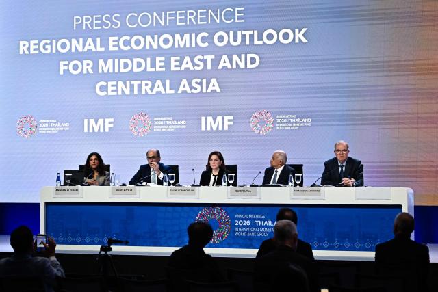 (L-R) IMF Communications Officer Angham Al Shami, IMF Middle East and Central Asia Department Director Jihad Azour, IMF Middle East and Central Asia Department Deputy Director Taline Koranchelian, IMF Middle East and Central Asia Department Deputy Director Subir Lall and IMF Middle East and Central Asia Department Deputy Director Athanasios Arvanitis attend the Regional Economic Outlook for the Middle East and Central Asia press briefing at the Annual Meetings of the International Monetary Fund (IMF) and the World Bank Group (WBG) at the Queen Sirikit National Convention Center (QSNCC) in Bangkok on October 15, 2026. (Photo by Lillian SUWANRUMPHA / AFP)