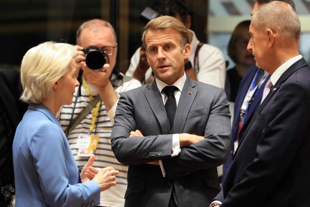 (LtoR) European Commission President Ursula von der Leyen, France's President Emmanuel Macron and Czech Republic's Prime Minister Andrej Babis speak together ahead of a round table as part of a European Union summit at the EU headquarters in Brussels on October 15, 2026. EU leaders head on October 15, 2026 for their biggest clash yet over the bloc's next long-term budget, as they race to lock in a deal before next year's French presidential election. (Photo by Ludovic MARIN / AFP)
