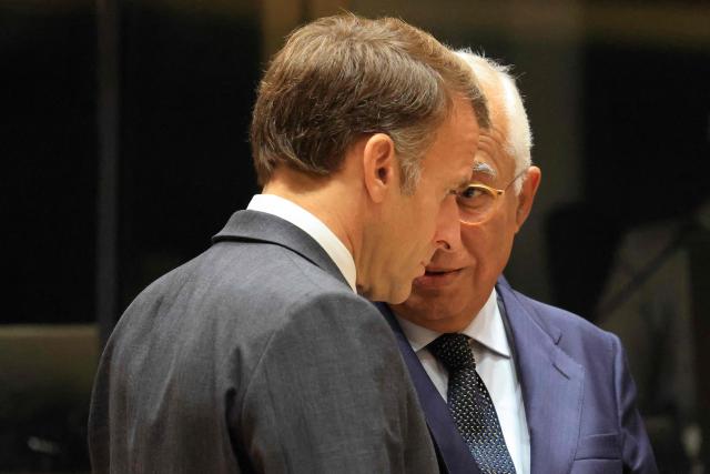 France's President Emmanuel Macron (L) and European Council President Antonio Costa speak together ahead of a round table as part of a European Union summit at the EU headquarters in Brussels on October 15, 2026. EU leaders head on October 15, 2026 for their biggest clash yet over the bloc's next long-term budget, as they race to lock in a deal before next year's French presidential election. (Photo by Ludovic MARIN / AFP)