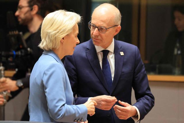 European Commission President Ursula von der Leyen (L) and Luxembourg's Prime Minister Luc Frieden speak together ahead of a round table as part of a European Union summit at the EU headquarters in Brussels on October 15, 2026. EU leaders head on October 15, 2026 for their biggest clash yet over the bloc's next long-term budget, as they race to lock in a deal before next year's French presidential election. (Photo by Ludovic MARIN / AFP)