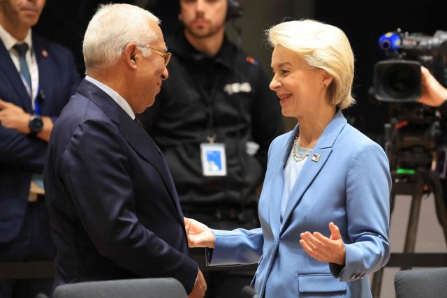 European Council President Antonio Costa (L) speaks with European Commission President Ursula von der Leyen (R) ahead of a round table as part of a European Union summit at the EU headquarters in Brussels on October 15, 2026. EU leaders head on October 15, 2026 for their biggest clash yet over the bloc's next long-term budget, as they race to lock in a deal before next year's French presidential election. (Photo by Ludovic MARIN / AFP)