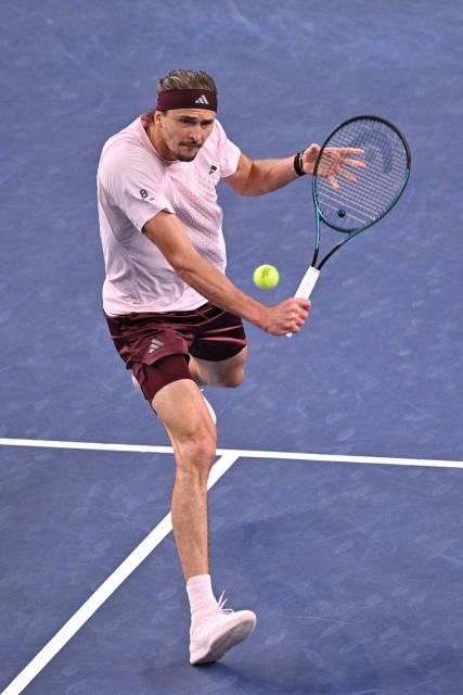 Germany's Alexander Zverev hits a return to Australia's Alex de Minaur during their men's singles quarter-final match at the Shanghai Masters tennis tournament in Shanghai on October 15, 2026. (Photo by Hector RETAMAL / AFP)