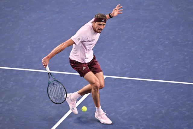Germany's Alexander Zverev hits a return to Australia's Alex de Minaur during their men's singles quarter-final match at the Shanghai Masters tennis tournament in Shanghai on October 15, 2026. (Photo by Hector RETAMAL / AFP)