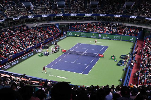 Germany's Alexander Zverev serves to Australia's Alex de Minaur during their men's singles quarter-final match at the Shanghai Masters tennis tournament in Shanghai on October 15, 2026. (Photo by Hector RETAMAL / AFP)